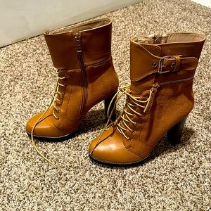 Like new, Laced boots, perfect for game day or sporting events.